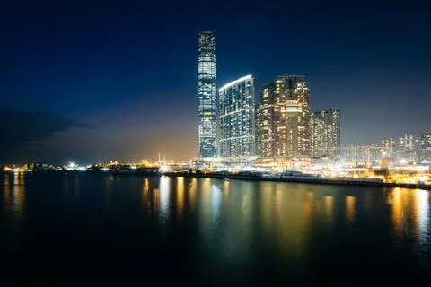 Skyscrapers in Kowloon at night, seen from Tsim Sha Tsui, in Kowloon, Hong Ko Stock Photos