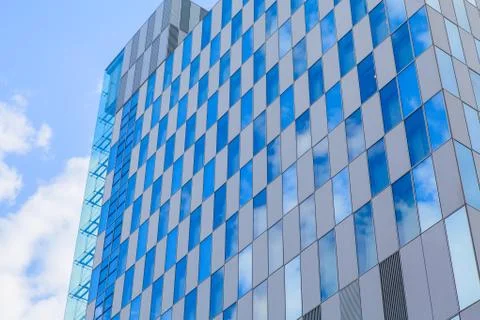 Skyscrapers office building with clouds reflection Stock Photos