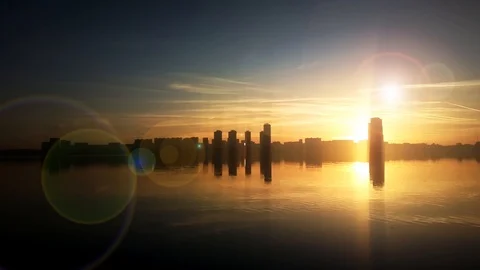 Skyscrapers skyline sunset with dramatic light flare background Stock Footage 89868762