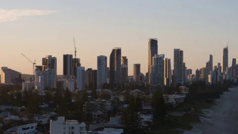 Skyscrapers spread along the beach at sunset Stock Footage 80993954