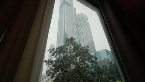 Skyscrapers through a hotel window. Stock Footage 314630899