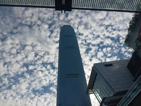 Skyscrapers under surreal cloudscape Stock Photos
