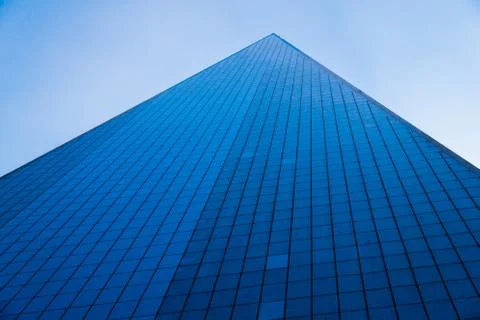 Skyscrapper seen from below. Losing itself in the sky. Stock Photos