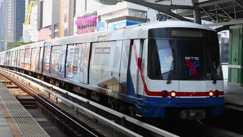 Skytrain Arriving at Elevated Urban Station in Bangkok Stock Footage 323160728