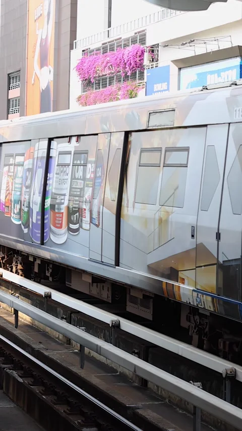 Skytrain Arriving at Elevated Urban Station in Bangkok Stock Footage 324883654