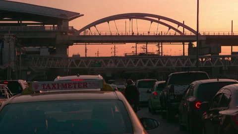 Skytrain passed by heavy traffic morning rush hour in Bangkok Thailand Stock Footage 154347964