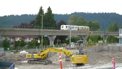 Skytrain Passing over Construction Site - Train passing over Building Site Stock Footage 201039605