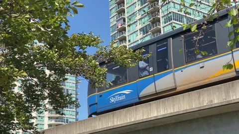 Skytrain in transit with condominium building Stock Footage 280879394