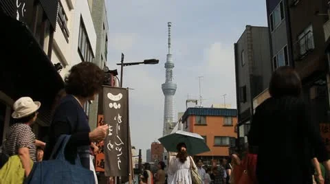 Skytree tower seen at market in Asakusa, Tokyo Stock Footage 12135853