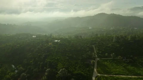 Skyward Escapade: Discovering 4K Mountain Clouds in the Jungle's Embrace Stock Footage 244475112