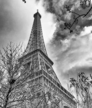 Skyward view of Eiffel Tower on a cloudy winter day - France Stock Photos