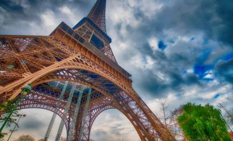 Skyward view of Eiffel Tower on a cloudy winter day - France Stock Photos