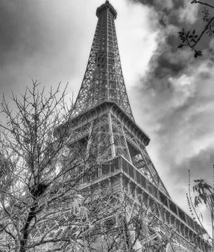 Skyward view of Eiffel Tower on a cloudy winter day - France Stock Photos