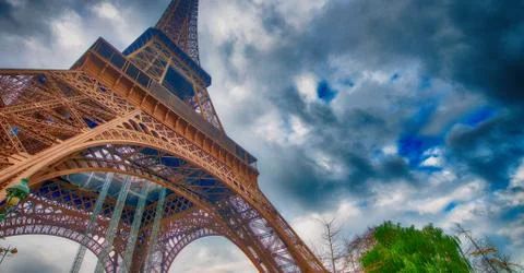 Skyward view of Eiffel Tower on a cloudy winter day - France Stock Photos