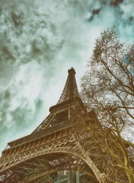 Skyward view of Eiffel Tower on a cloudy winter day - France Stock Photos