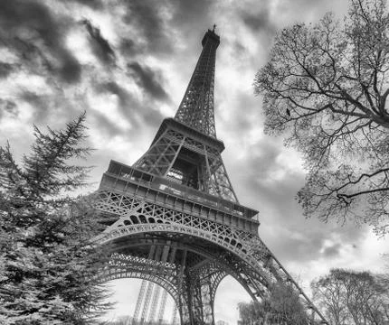 Skyward view of Eiffel Tower on a cloudy winter day - France Stock Photos