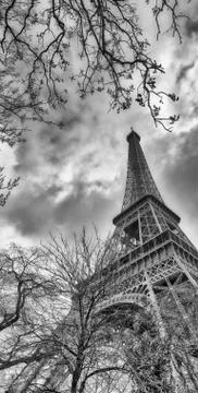 Skyward view of Eiffel Tower on a cloudy winter day - France Stock Photos