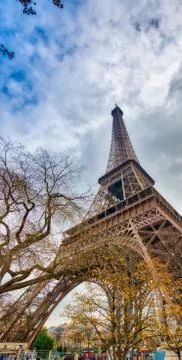 Skyward view of Eiffel Tower on a cloudy winter day - France Stock Photos