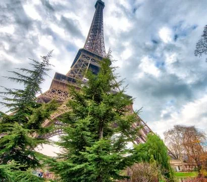 Skyward view of Eiffel Tower on a cloudy winter day - France Stock Photos