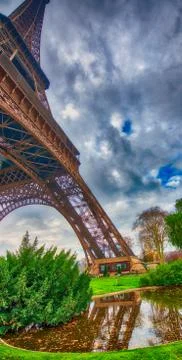 Skyward view of Eiffel Tower on a cloudy winter day - France Stock Photos