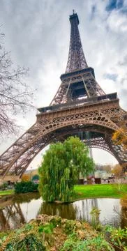 Skyward view of Eiffel Tower on a cloudy winter day - France Stock Photos