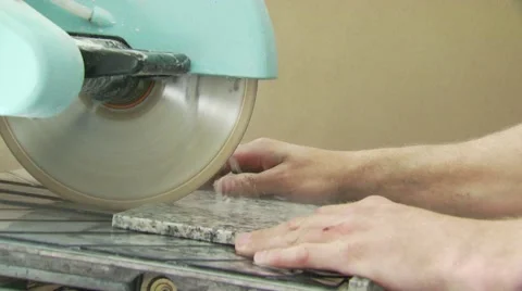 Slab of granite being cut with circular saw Stock Footage 55570534