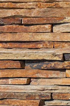 Slabs of old sandstone in a stack, background and texture, close-up. Stock Photos