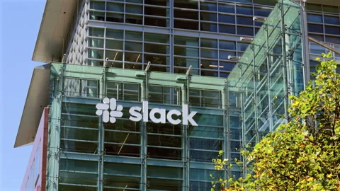 Slack sign and logo on their office headquarters building in San Francisco Stock Footage 249715230