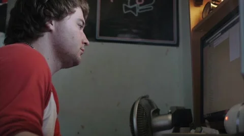 Slacker Browses Through Facebook Stock Footage 41554094