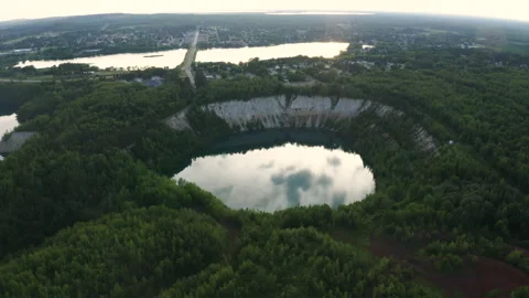 Slackline balanced walk over large chasm of pristine water and woods. High 4 Stock Footage 158402774