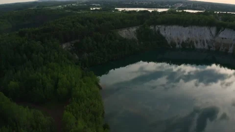 Slackline balanced walk over large chasm of pristine water and woods. High 7 Stock Footage 158402922