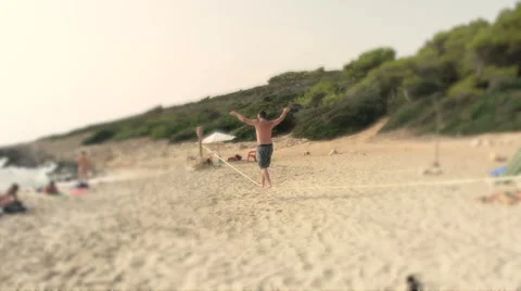 Slackline on beach Majorca, Spain Stock Footage 43386500
