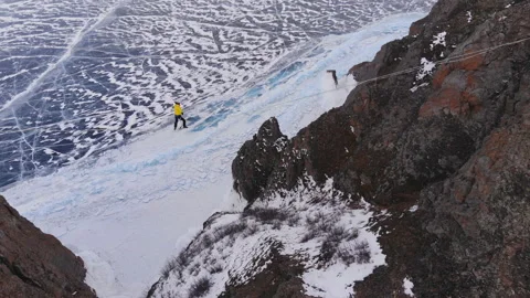 Slackline training high above the big lake. 動画素材 110953962