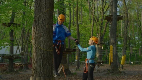 Slacklining in an adventure park Stock Footage 99962050