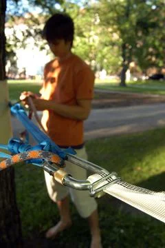 Slacklining or walking on a tightrope Stock Photos
