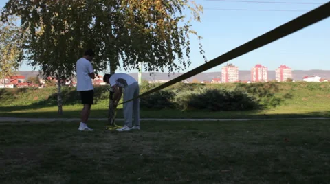 Slacklining setting up Video stock 32453536