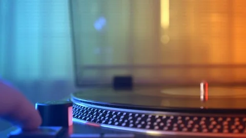 Slade vinyl record player turntable on a background of red and blue lights Stock Footage 91708281