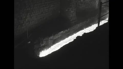 Slag flowing through open hearth furnace in steel mill Stock Footage 44571059