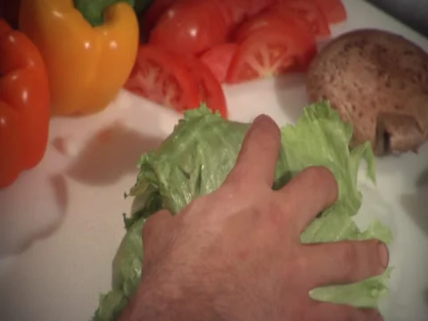 Slamming lettuce onto cutting board, static Stock Footage 26191315