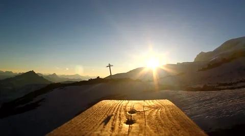 The slanting rays of the setting sun on a wooden walkway over the tops Stock Footage 53020309