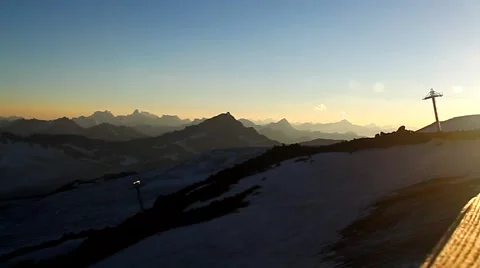 The slanting rays of the setting sun on a wooden walkway over the tops Stock Footage 53850259