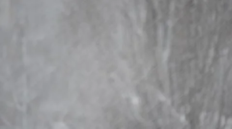 Slanting snow falling on blurred background of big leafless tree Stock Footage 47176520