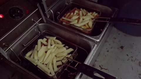Slap chips inside deep fryers Stock Footage 254796720
