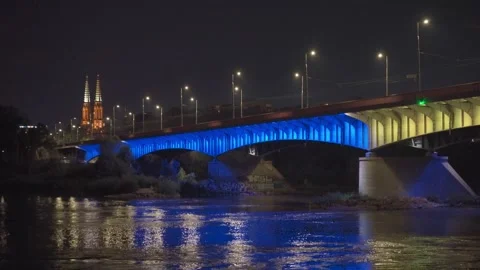 Śląsko-Dąbrowski Bridge. Ilumination in colors of Ukrainian flag. Warsaw Stock Footage 249877071