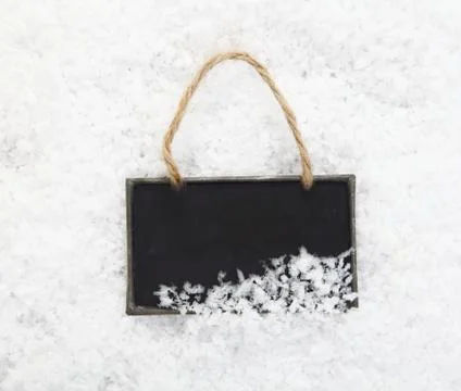 Slate chalkboard in snow Stock Photos