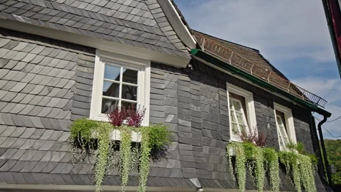 Slate-Clad House Facade with Flower Boxes in Freudenberg Stock Footage 344382861