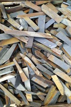 Slate stone blocks. many different shapes and colors. piled up Stock Photos