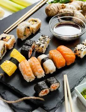 Slate tray of assorted sushi Stock Photos