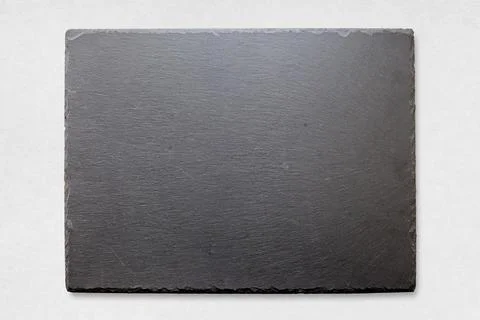 Slate tray on a white surface Foto stock