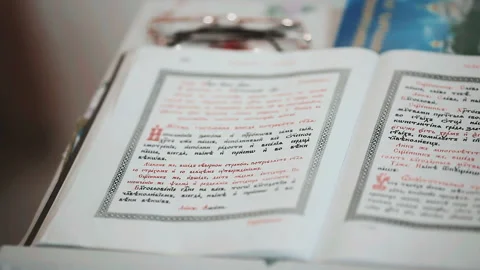 Slavic Bible with open pages. Old religious book in church. Orthodox Holy Bible Video stock 85755116